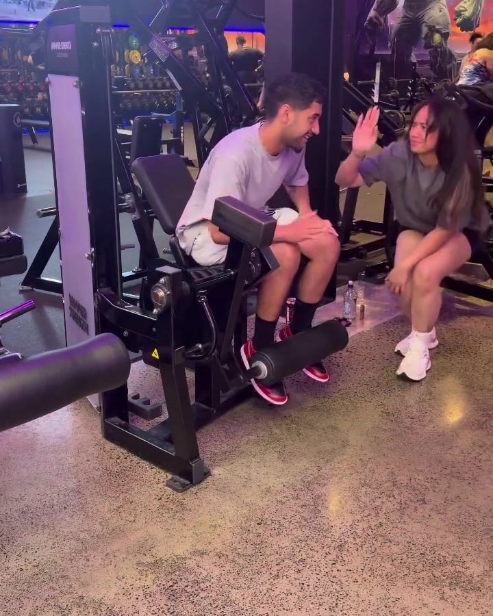 Rachel high-fiving a client after a set at Fitness Cartel